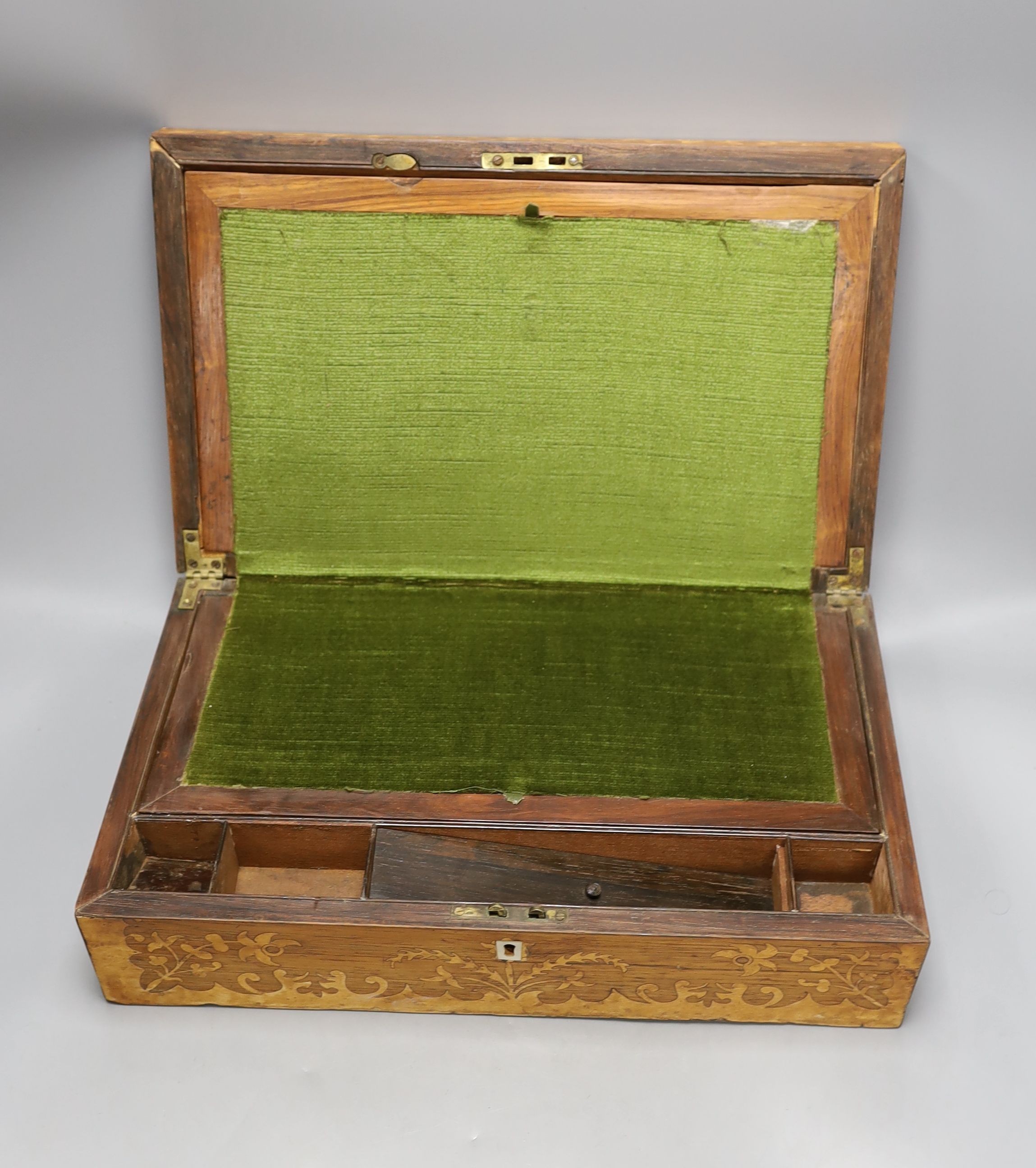 An early 20th century inlaid mahogany lancet shaped mantel clock and a Victorian rosewood and marquetry writing slope, writing slope, 41 cms wide x 12 cms high.